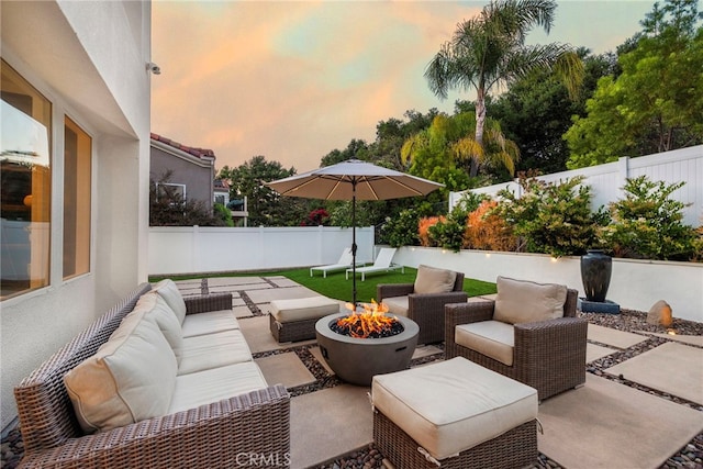 38 Via Sonrisa, San Clemente, CA 92673 - patio terrace at dusk with an outdoor living space with a fire pit, a patio, and a fenced backyard