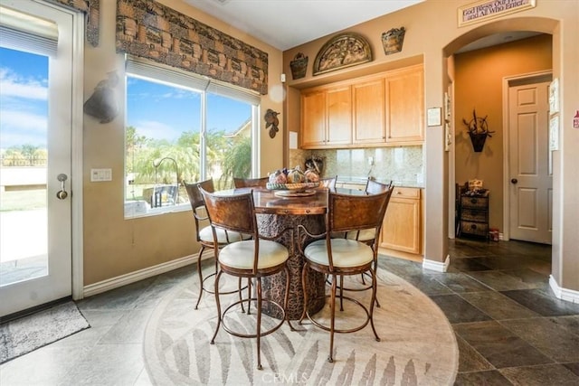 889 Highridge St, Riverside, CA 92506 - dining room featuring arched walkways and baseboards