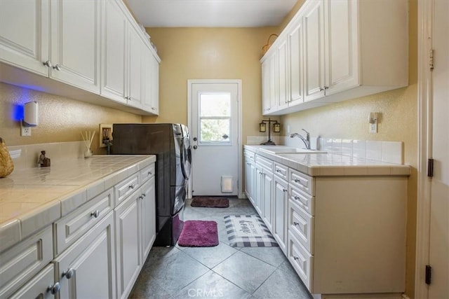889 Highridge St, Riverside, CA 92506 - laundry room featuring cabinet space, independent washer and dryer, and light tile patterned floors