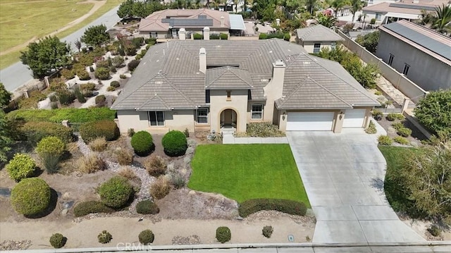 889 Highridge St, Riverside, CA 92506 - view of front of property with driveway, a tile roof, a garage, and stucco siding