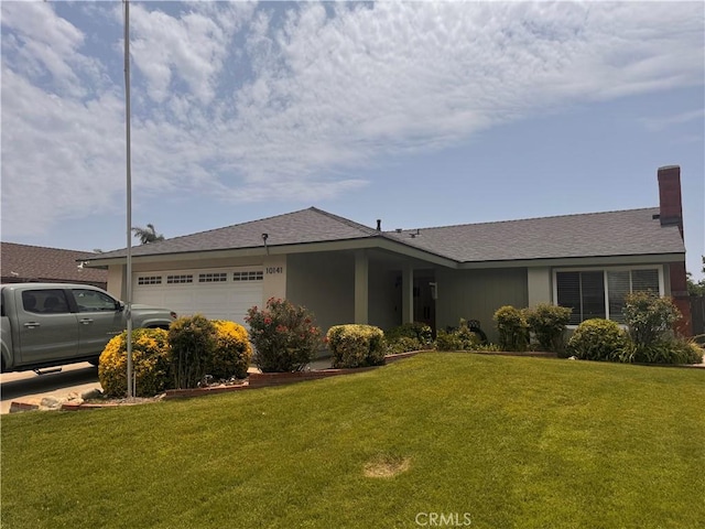 10141 Orange St, Rancho Cucamonga, CA 91737 - single story home with a garage, a front yard, and a chimney