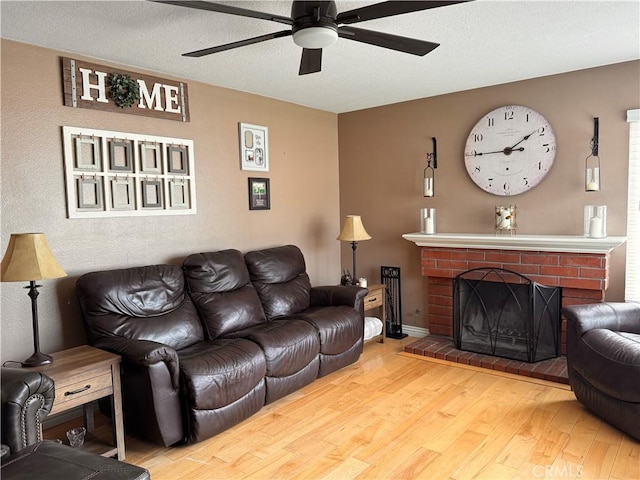 10141 Orange St, Rancho Cucamonga, CA 91737 - living area featuring wood finished floors, ceiling fan, a fireplace, and baseboards
