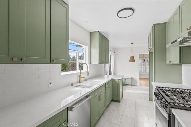 16801 Nordhoff St, Northridge, CA 91343 - kitchen featuring green cabinets, stainless steel appliances, tasteful backsplash, and light countertops
