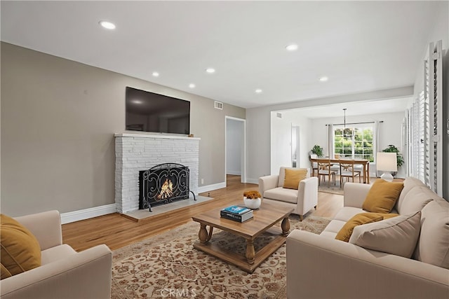 16801 Nordhoff St, Northridge, CA 91343 - living room with light wood-style flooring, recessed lighting, and a fireplace