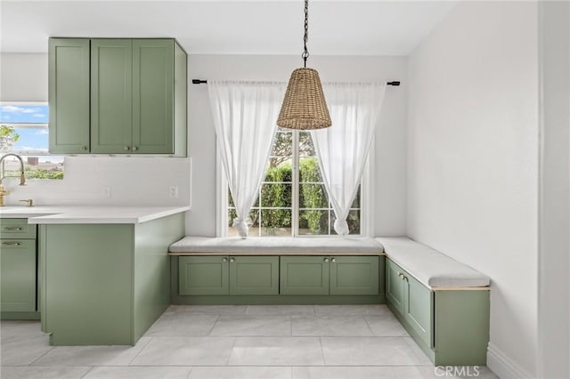 16801 Nordhoff St, Northridge, CA 91343 - kitchen with green cabinets, healthy amount of natural light, and light countertops
