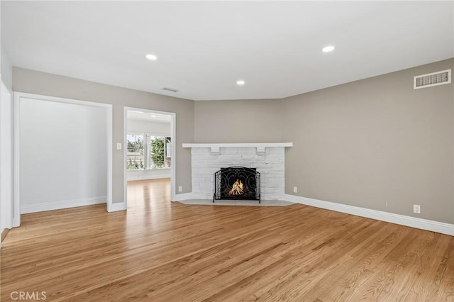 16801 Nordhoff St, Northridge, CA 91343 - unfurnished living room featuring light wood-type flooring, a fireplace, and recessed lighting