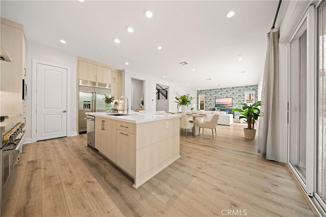 271 Huckleberry, Lake Forest, CA 92630 - kitchen with light brown cabinetry, open floor plan, modern cabinets, a sink, and recessed lighting