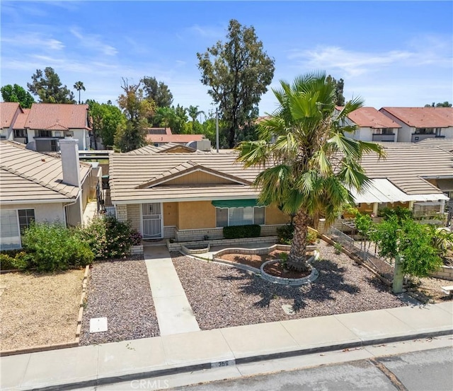 356 Myrl Pl, Hemet, CA 92545 - view of front facade featuring a tiled roof, a residential view, and brick siding