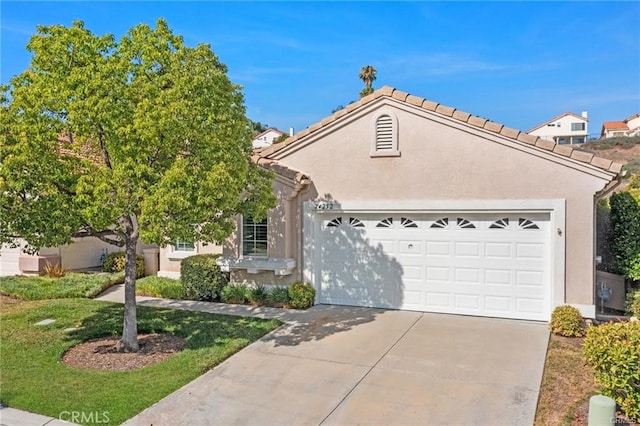 24252 Calle Artino, Murrieta, CA 92562 - view of front of property with a garage, concrete driveway, and stucco siding