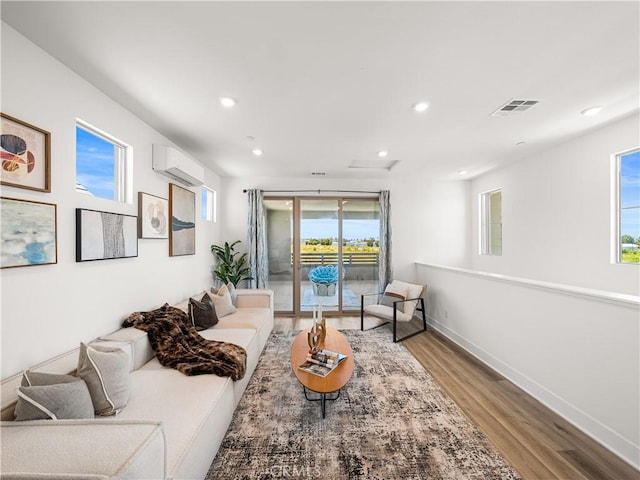 191 Lynx, Irvine, CA 92618 - living area featuring a wall mounted air conditioner, wood finished floors, recessed lighting, and baseboards