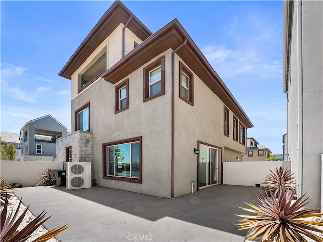 191 Lynx, Irvine, CA 92618 - rear view of house with a patio, stucco siding, and a cooling unit