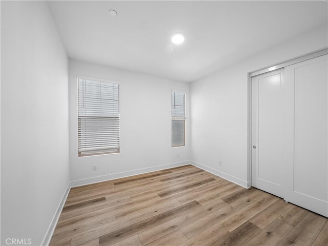 191 Lynx, Irvine, CA 92618 - unfurnished bedroom with light wood-type flooring, baseboards, and a closet