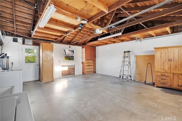 11777 Preston Ln, Yucaipa, CA 92399 - garage featuring a garage door opener and washer / clothes dryer