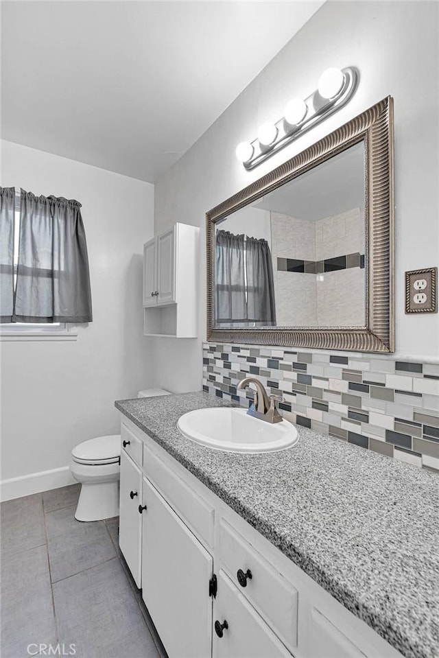 11777 Preston Ln, Yucaipa, CA 92399 - bathroom with vanity, tile patterned flooring, decorative backsplash, and tiled shower
