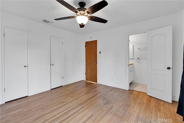 11777 Preston Ln, Yucaipa, CA 92399 - unfurnished bedroom featuring light wood finished floors, ensuite bathroom, and ceiling fan