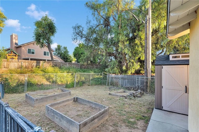 11777 Preston Ln, Yucaipa, CA 92399 - fenced backyard featuring a vegetable garden and a storage shed