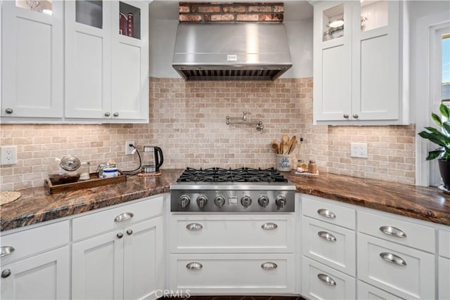 5215 Columbia Way, Lancaster, CA 93536 - kitchen with wall chimney exhaust hood, stainless steel gas cooktop, backsplash, and white cabinetry