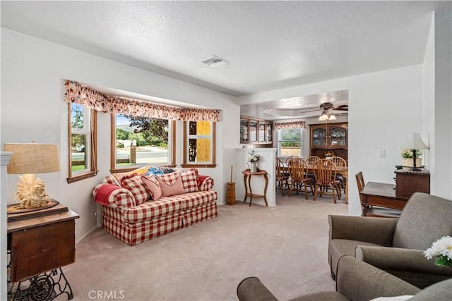 5215 Columbia Way, Lancaster, CA 93536 - living area with light colored carpet and a ceiling fan