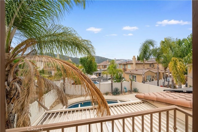 46239 Lone Pine Dr, Temecula, CA 92592 - view of pool with a jacuzzi, a fenced backyard, and a residential view