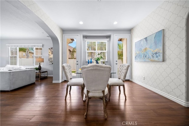 46239 Lone Pine Dr, Temecula, CA 92592 - dining space with wallpapered walls, arched walkways, baseboards, an accent wall, and recessed lighting