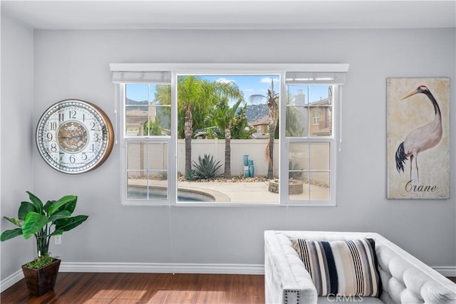 46239 Lone Pine Dr, Temecula, CA 92592 - sitting room with wood finished floors, plenty of natural light, and baseboards
