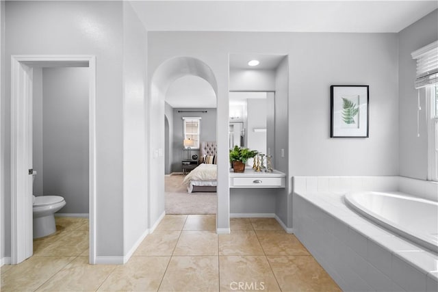 46239 Lone Pine Dr, Temecula, CA 92592 - full bathroom with a bath, toilet, baseboards, and tile patterned flooring
