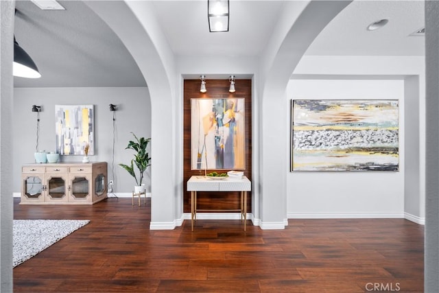 46239 Lone Pine Dr, Temecula, CA 92592 - foyer featuring arched walkways, baseboards, and wood finished floors