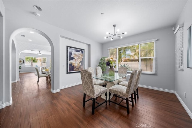 46239 Lone Pine Dr, Temecula, CA 92592 - dining room with arched walkways, a chandelier, healthy amount of natural light, and dark wood-style floors