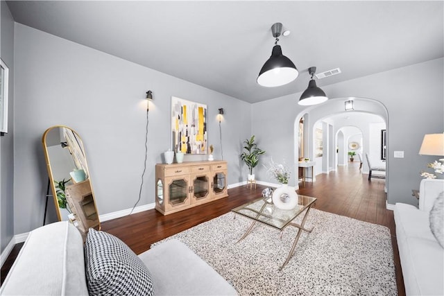 46239 Lone Pine Dr, Temecula, CA 92592 - living room featuring arched walkways, wood finished floors, and baseboards