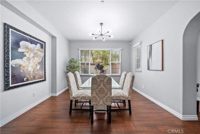 46239 Lone Pine Dr, Temecula, CA 92592 - dining space featuring arched walkways, a chandelier, wood finished floors, and baseboards