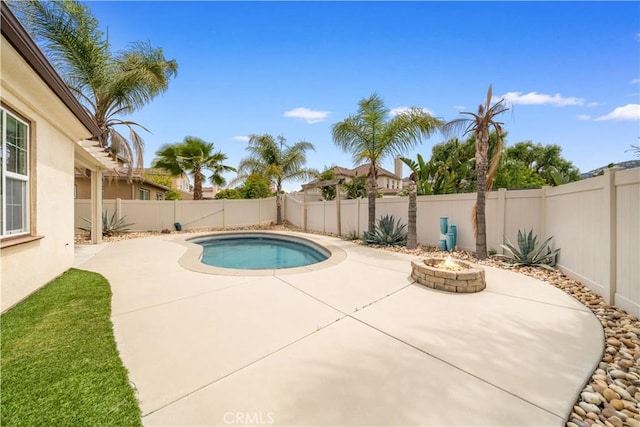 46239 Lone Pine Dr, Temecula, CA 92592 - view of swimming pool with a patio area, an outdoor fire pit, and a fenced backyard