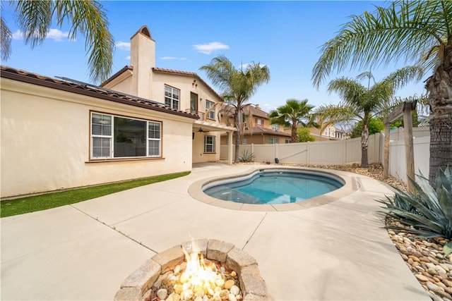 46239 Lone Pine Dr, Temecula, CA 92592 - view of pool featuring a fenced backyard, a patio, and an outdoor fire pit