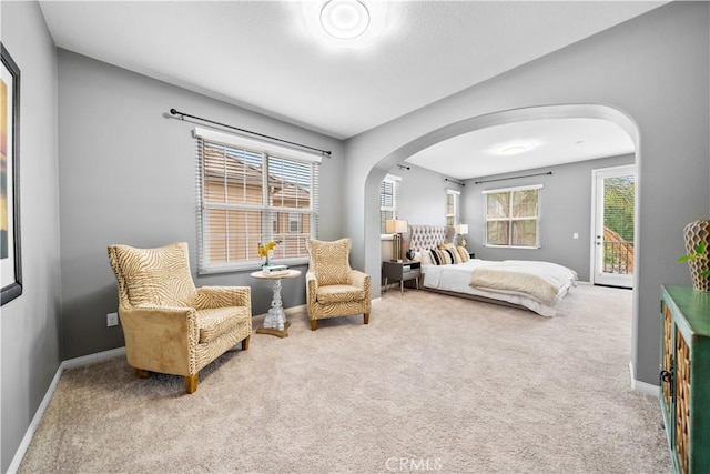 46239 Lone Pine Dr, Temecula, CA 92592 - carpeted bedroom with arched walkways, access to outside, and baseboards