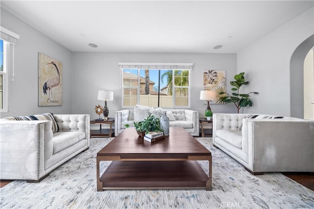 46239 Lone Pine Dr, Temecula, CA 92592 - living room featuring arched walkways and wood finished floors