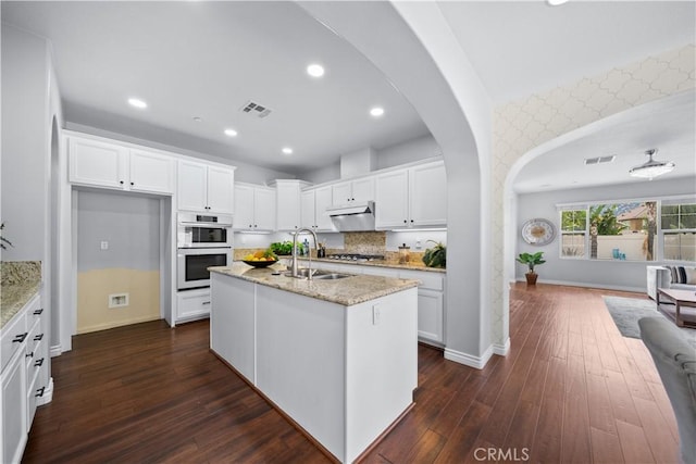 46239 Lone Pine Dr, Temecula, CA 92592 - kitchen with a sink, baseboards, under cabinet range hood, double oven, and recessed lighting