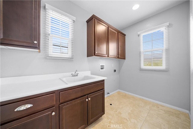 46239 Lone Pine Dr, Temecula, CA 92592 - laundry room featuring hookup for a washing machine, cabinet space, electric dryer hookup, baseboards, and hookup for a gas dryer