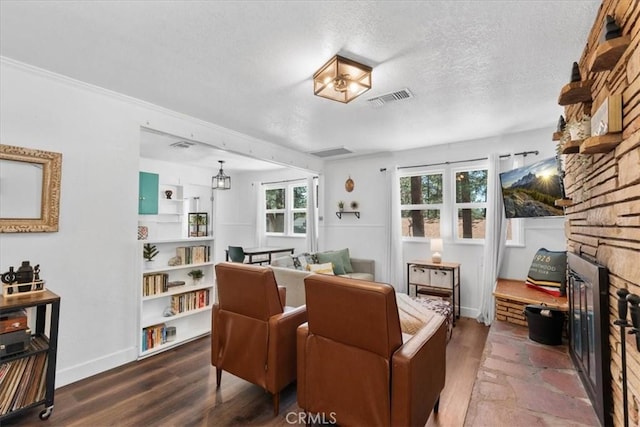 1698 Thrush Rd, Wrightwood, CA 92397 - living area featuring wood finished floors, a textured ceiling, and baseboards