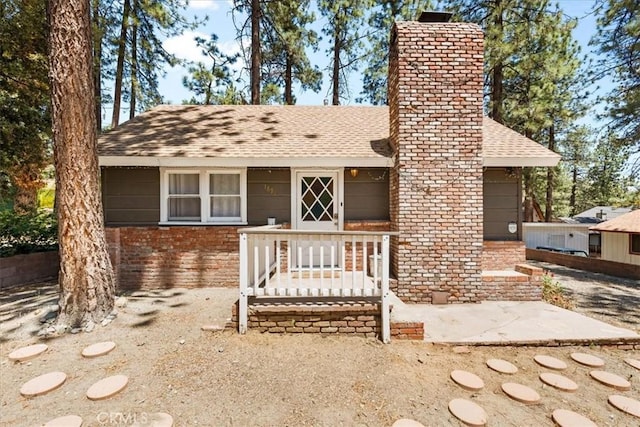 1698 Thrush Rd, Wrightwood, CA 92397 - view of front of property with a chimney, roof with shingles, and brick siding