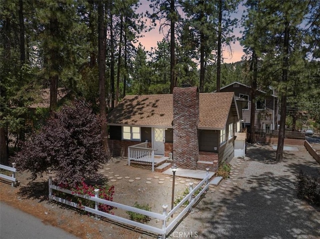 1698 Thrush Rd, Wrightwood, CA 92397 - view of front facade featuring a chimney and a shingled roof