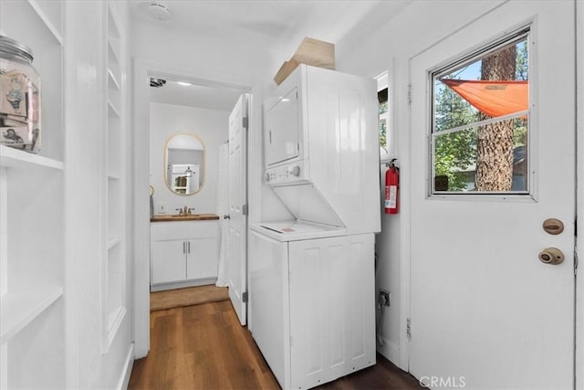 1698 Thrush Rd, Wrightwood, CA 92397 - laundry room featuring estacked washer and dryer and dark wood-type flooring