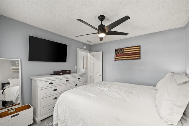 15326 Leffingwell Rd, Whittier, CA 90604 - bedroom featuring a textured ceiling, ceiling fan, and wood finished floors