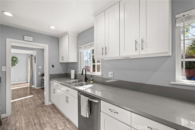 15326 Leffingwell Rd, Whittier, CA 90604 - kitchen with stainless steel dishwasher, white cabinetry, light wood-style floors, and recessed lighting