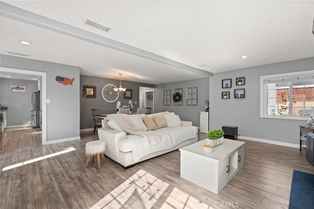 15326 Leffingwell Rd, Whittier, CA 90604 - living room with wood finished floors, a chandelier, and recessed lighting