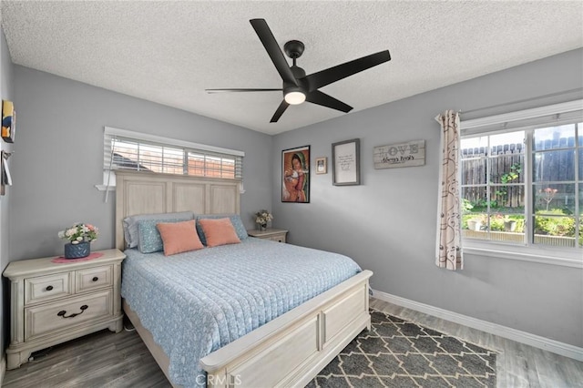 15326 Leffingwell Rd, Whittier, CA 90604 - bedroom with dark wood-type flooring, a textured ceiling, and ceiling fan