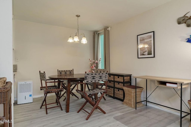 3700 Dean Dr Unit 1805, Ventura, CA 93003 - dining space with light wood-type flooring and a chandelier