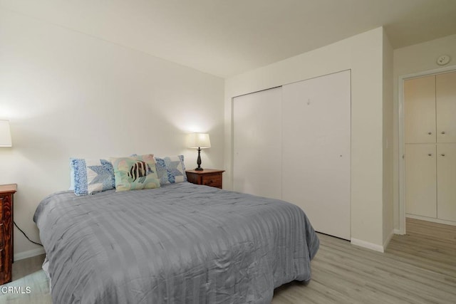 3700 Dean Dr Unit 1805, Ventura, CA 93003 - bedroom with baseboards, light wood-style flooring, and a closet