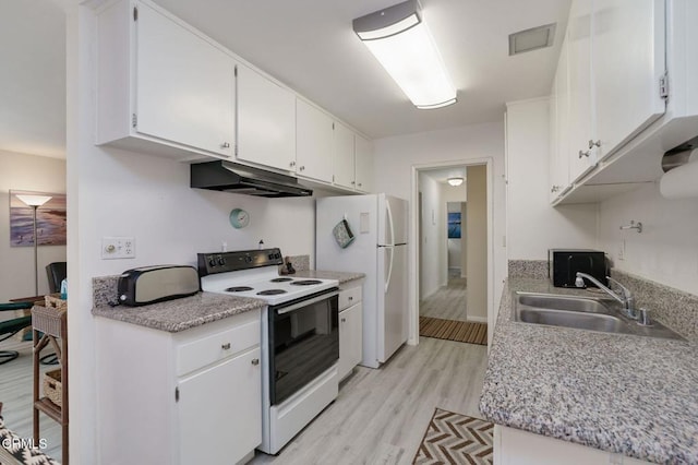 3700 Dean Dr Unit 1805, Ventura, CA 93003 - kitchen with white appliances, under cabinet range hood, a sink, light wood finished floors, and light countertops