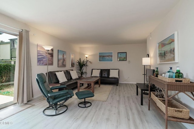 3700 Dean Dr Unit 1805, Ventura, CA 93003 - living area with light wood-style flooring and baseboards