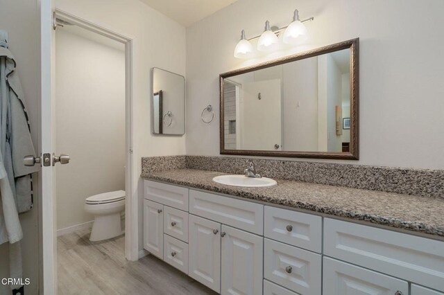 3700 Dean Dr Unit 1805, Ventura, CA 93003 - bathroom with vanity and wood finished floors