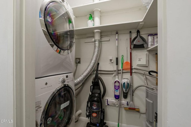 3700 Dean Dr Unit 1805, Ventura, CA 93003 - laundry room featuring stacked washer / dryer and baseboards